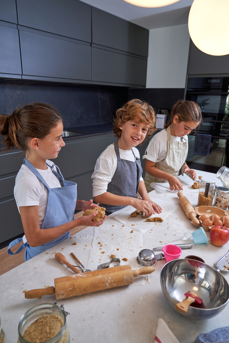 Kids cooking together in kitchen